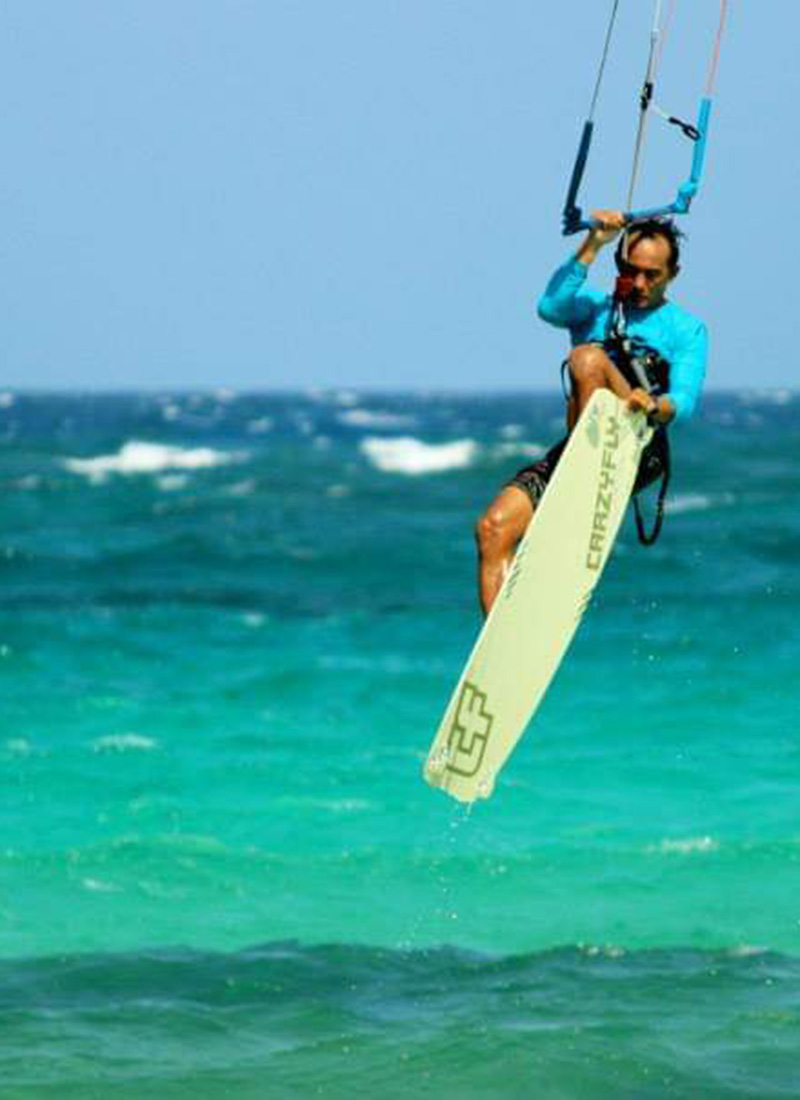 Kitesurfer riding the waves at Boca Grandi